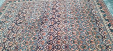 A MACHINE MADE CARPET OF PERSIAN DESIGN 340 x 250cms