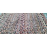 A MACHINE MADE CARPET OF PERSIAN DESIGN 340 x 250cms