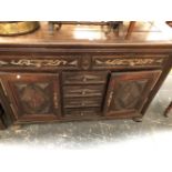 A 19th C. FRENCH OAK DRESSER, THE TWO DRAWERS WITH IRON HANDLES AND BRASS APPLIQUES, THE CENTRAL