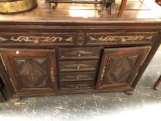 A 19th C. FRENCH OAK DRESSER, THE TWO DRAWERS WITH IRON HANDLES AND BRASS APPLIQUES, THE CENTRAL