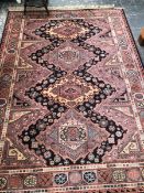 A MACHINE MADE RUG OF CAUCASIAN DESIGN 240 x 170cms