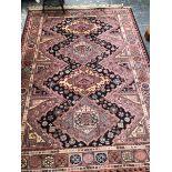 A MACHINE MADE RUG OF CAUCASIAN DESIGN 240 x 170cms