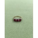 A 9ct GOLD HALLMARKED RUBY AND DIAMOND CLUSTER HALF HOOP RING. APPROX DIAMOND WEIGHT 0.15cts, WEIGHT