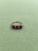 A 9ct GOLD HALLMARKED RUBY AND DIAMOND CLUSTER HALF HOOP RING. APPROX DIAMOND WEIGHT 0.15cts, WEIGHT