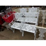 A PAINTED PATIO SUITE CONSISTING OF A BENCH, TWO ARMCHAIRS AND A LOW TABLE