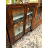 A 20th C. OAK DISPLAY CABINET, THE LEADED COLOURED GLASS DOORS ENCLOSING FOUR SHELVES. W 90 x D 25 x