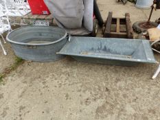 A LARGE GALVANIZED BASIN TOGETHER WITH A GALVANIZED TROUGH