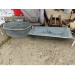 A LARGE GALVANIZED BASIN TOGETHER WITH A GALVANIZED TROUGH