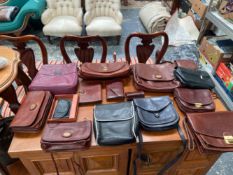 A COLLECTION OF HANDBAGS AND PURSES TO INCLUDE , THE BRIDGE, OSPREY ETC (15)
