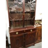 AN EARLY 19th C. MAHOGANY DISPLAY CABINET, THE UPPER HALF WITH GLAZED DOORS, THE LOWER HALF WITH A