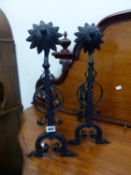 A PAIR OF WROUGHT IRON FIRE DOGS.