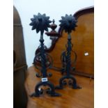 A PAIR OF WROUGHT IRON FIRE DOGS.