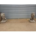 A LARGE PAIR OF COMPOSITE SEATED LIONS