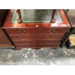 A MODERN MAHOGANY WRITING TABLE, THE LEATHER INSET TOP ABOVE FOUR FILING DRAWERS. W 94 x D 61 x H