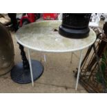 A WROUGHT IRON CIRCULAR PATIO TABLE