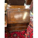 A MODERN BURR WOOD BUREAU, THE FALL ABOVE TWO DRAWERS AND CABRIOLE LEGS CARVED AT THE KNEES WITH