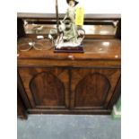 A MID 19th C. ROSEWOOD CHIFFONIERE, THE MIRRORED BACK SHELF ABOVE TO LANCET PANELLED DOORS WITH RING