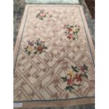 A FLORAL HOOKED RUG 239 x 150cms