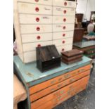 A WHITE PAINTED STORAGE CHEST OF TWO BANKS OF EIGHT DRAWERS TOGETHER WITH A PLAN CHEST OF FIVE