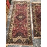 TWO MACHINE MADE PERSIAN DESIGN SMALL RUNNERS LARGEST 230 x 93cms.