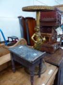 A GILDED SPELTER FIGURAL OCCASIONAL TABLE AND A SHOE SHINE STOOL.