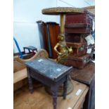 A GILDED SPELTER FIGURAL OCCASIONAL TABLE AND A SHOE SHINE STOOL.