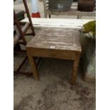 A SMALL COTSWOLD TEAK PATIO TABLE