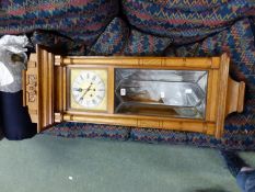 A LARGE ART DECO OAK CASED WALL CLOCK.