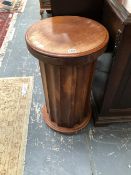 A 19th C. MAHOGANY FLUTED COLUMNAR BEDSIDE CUPBOARD WITH CATCH RELEASE DOOR. Dia. 40 x H 71cms.