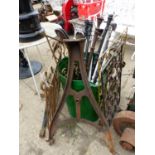 VARIOUS PAINTED CAST IRON RODS, TOGETHER WITH A PAIR OF ANTIQUE CAST IRON BENCH ENDS, A LARGE CAST