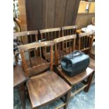 A SET OF SIX 19th C. OAK CHAIRS, THE BACKS OF FOUR REEDED UPRIGHTS OVER BOWED SEATS AND TAPERING