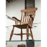 AN OAK SPINNING WHEEL TOGETHER WITH PINE ELBOW KITCHEN CHAIR