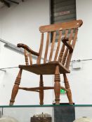 AN OAK SPINNING WHEEL TOGETHER WITH PINE ELBOW KITCHEN CHAIR