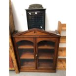 A 19th C. MAHOGANY CABINET WITH GLAZED DOORS BELOW A TRIANGULAR PEDIMENT. W 81 x D 30 x H 100cms.