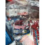 A GROUP OF TRANSFORMERS TOYS, UNBOXED AND SOME WITH CARD BACKINGS, ANNUAL ETC