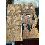 M. KASANENE 1976, TWO WOODEN PANELS CARVED WITH AFRICAN FIGURES GOING ABOUT COUNTRY WORKS. 81 x
