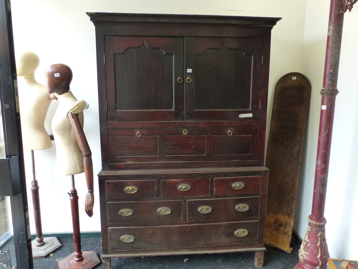 A 19th C. OAK SIDE CABINET, THE TOP WITH TWO DOORS ENCLOSING SHELVES OVER A PULL DOWN DOOR, THE BASE