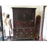 A 19th C. OAK SIDE CABINET, THE TOP WITH TWO DOORS ENCLOSING SHELVES OVER A PULL DOWN DOOR, THE BASE