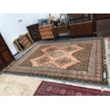 A TURKISH CARPET OF OUSHAK DESIGN 355 x 255cms