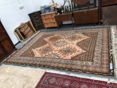 A TURKISH CARPET OF OUSHAK DESIGN 355 x 255cms