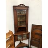 A LATE VICTORIAN SATIN WOOD CROSS BANDED AND LINE INLAID MAHOGANY CORNER CUPBOARD, THE CENTRAL SHELF