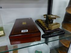 A MAHOGANY CASED LONGS SACCHAROMETER, A PAPIER MACHE SPECTACLE CASE AND A SET OF POSTAL SCALES