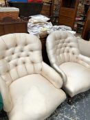 TWO SIMILAR VICTORIAN ARMCHAIRS WITH BUTTON UPHOLSTERED HOOP BACKS, THE TURNED MAHOGANY FRONT LEGS