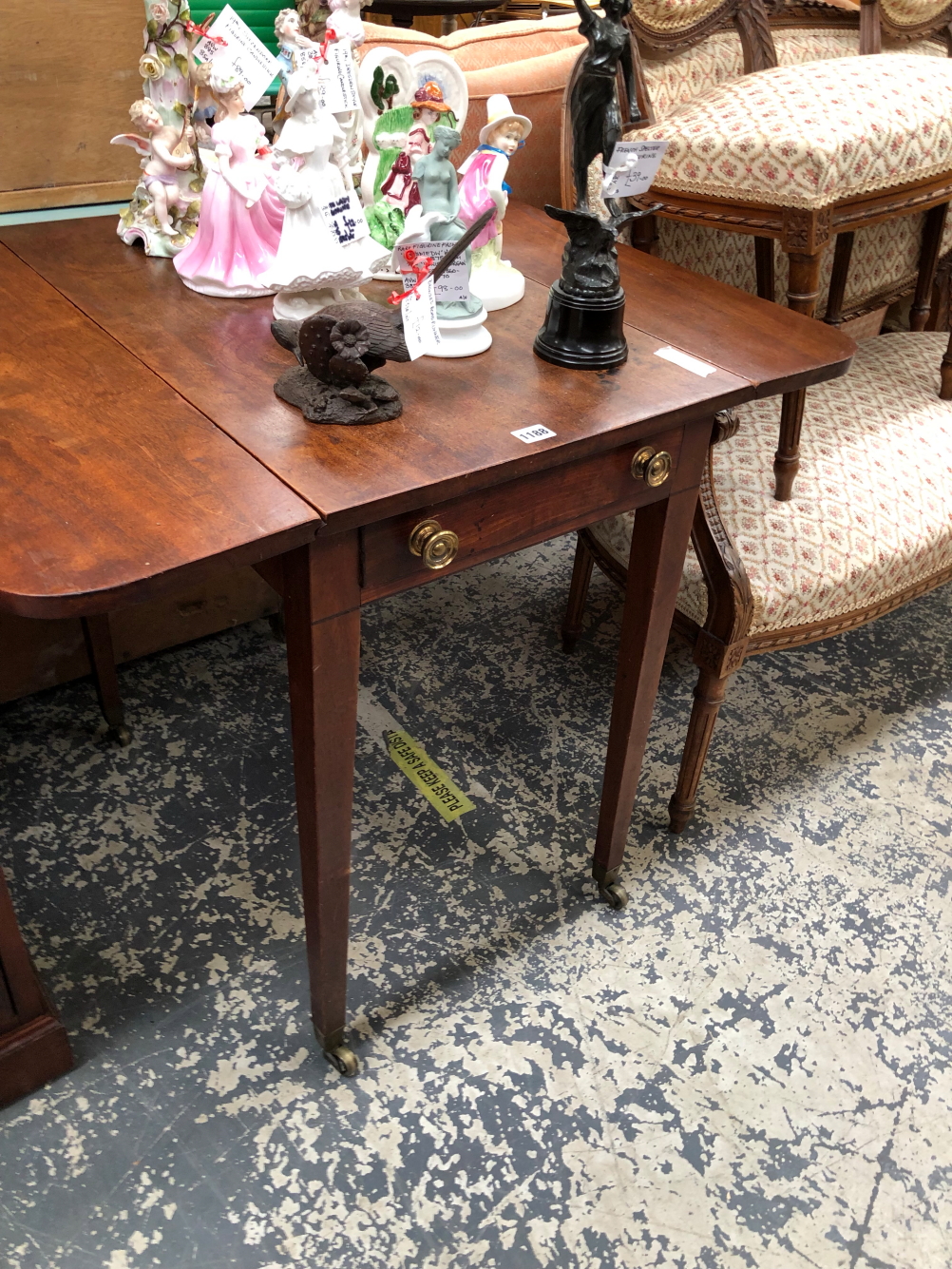 A 19th C. MAHOGANY PEMBROKE TABLE WITH A SINGLE DRAWER AND SQUARE SECTIONED LEGS TAPERING TO BRASS