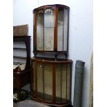 TWO 1940S GLAZED MAHOGANY DEMILUNE DISPLAY CABINETS, ONE WITH GILT DOORS, THE LARGER WITH CLEAR