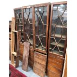 A 19th C. MAHOGANY BREAKFRONT BOOKCASE, THE UPPER HALF ASTRAGAL GLAZED, THE BASE WITH FOUR DOORS,