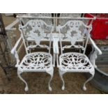 A PAIR OF PAINTED CAST IRON PATIO ARMCHAIRS