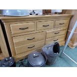 A MODERN OAK CHEST OF THREE SHORT DRAWERS OVER TWO BANKS OF TWO, EACH WITH AN IRON STRAP HANDLE. W