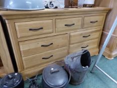 A MODERN OAK CHEST OF THREE SHORT DRAWERS OVER TWO BANKS OF TWO, EACH WITH AN IRON STRAP HANDLE. W