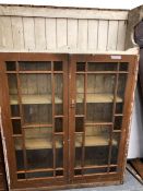 A PAINTED PINE DRESSER BACK WITH TWO GLAZED DOORS ENCLOSING SHELVES. W 123 x D 30 x H 187cms.